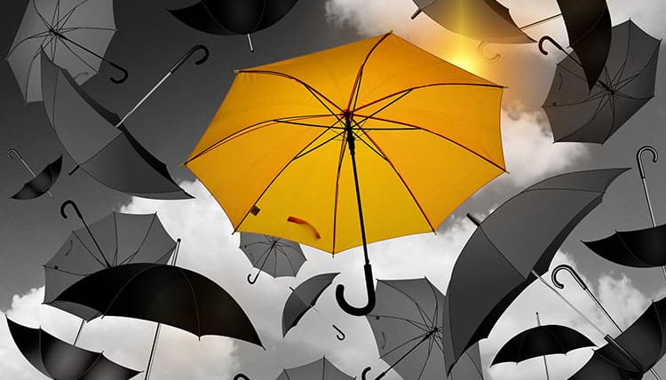 Yellow Umbrella Among Grey Ones